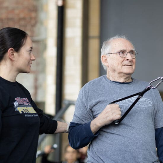 Certified personal trainer working with a client in Jamaica Plain gym