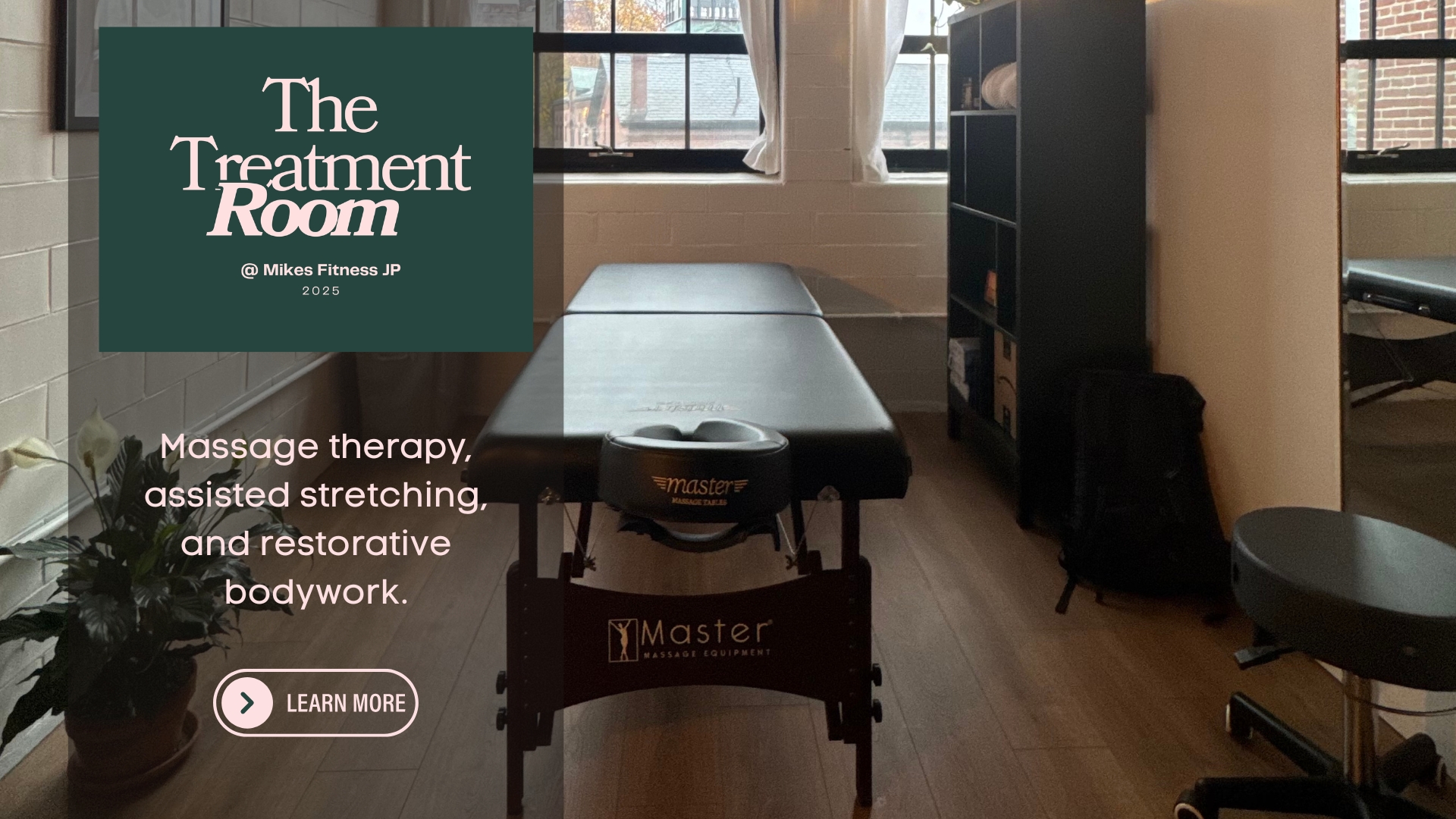 Massage therapy treatment room at Mike’s Fitness JP featuring massage table and recovery space in Jamaica Plain